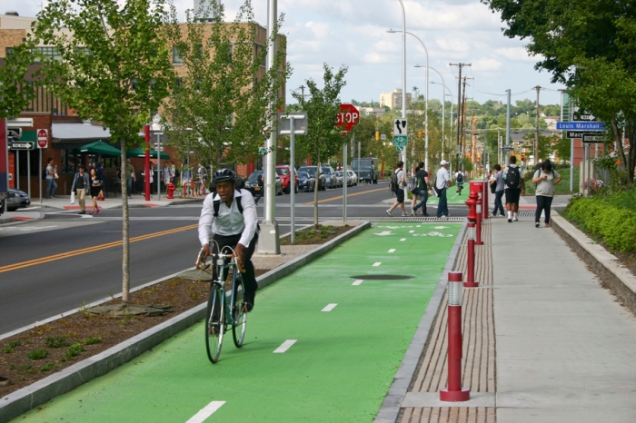 Raised and protected bike lanes along the Connective Corridor. Image courtesy of Barton & Loguidice.